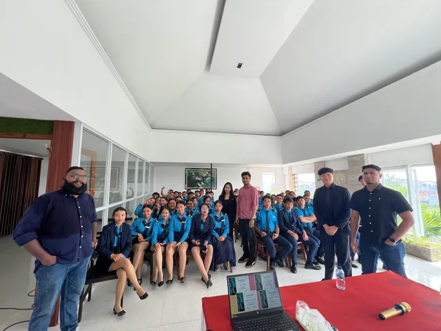 Students and visitors gathered for a photograph after a campus session